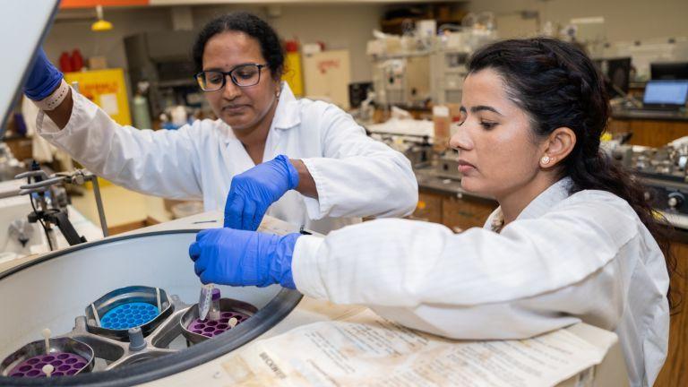 Two students in research lab